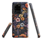 Phone case with colourful wildflowers on dark background, floral art design