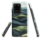Phone case with layered mountain and forest landscape in blue and green hues