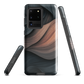 Phone case with flowing abstract design in black, copper and charcoal tones, inspired by dusk shadows