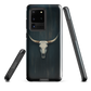 Longhorn skull set against a dark, textured backdrop - protective phone case.