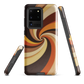 A retro-inspired phone case featuring warm swirling patterns in orange, yellow, and brown tones.