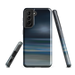Dark abstract phone case with blue and grey streaks and glossy finish.