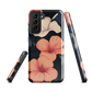 Phone case with coral hibiscus flowers and ivory blooms on dark background