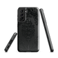 Black embossed damask phone case with gothic baroque pattern.