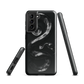 Phone case with detailed black python design on dark background.