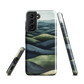 Phone case with layered mountain and forest landscape in blue and green hues