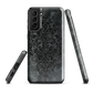 Dark damask patterned phone case with a vintage gothic aesthetic and textured stone background.
