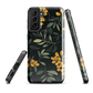 NZ Kowhai phone case with native yellow floral and green leaves on black background by designer Ben Hart.