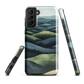 Phone case with layered mountain and forest landscape in blue and green hues