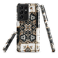 Moroccan tile pattern phone case in black, white, and gold tones with vintage-inspired design.