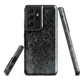 Dark damask patterned phone case with a vintage gothic aesthetic and textured stone background.