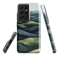 Phone case with layered mountain and forest landscape in blue and green hues