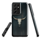 Longhorn skull set against a dark, textured backdrop - protective phone case.
