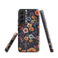 Phone case with colourful wildflowers on dark background, floral art design