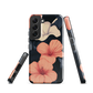 Phone case with coral hibiscus flowers and ivory blooms on dark background