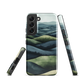 Phone case with layered mountain and forest landscape in blue and green hues