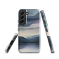 Phone case with moody blue and purple layered mountain and lake landscape artwork