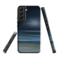 Dark abstract phone case with blue and grey streaks and glossy finish.