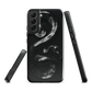 Phone case with detailed black python design on dark background.