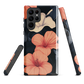 Phone case with coral hibiscus flowers and ivory blooms on dark background