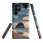 Phone case with Cathedral Cove beach and sunset scene, featuring soft skies and sea stack, by NZ artist Ben Hart.