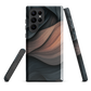 Phone case with flowing abstract design in black, copper and charcoal tones, inspired by dusk shadows