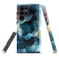 A modern abstract phone case featuring layered blue forms and soft flowing shapes.