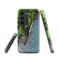 Resting Place phone case with aerial artwork of river rocks, green bush, and driftwood in a New Zealand stream.