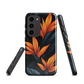 Phone case with bold orange bird of paradise flowers on dark background.