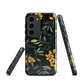 NZ Kowhai phone case with native yellow floral and green leaves on black background by designer Ben Hart.