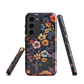 Phone case with colourful wildflowers on dark background, floral art design