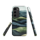 Phone case with layered mountain and forest landscape in blue and green hues