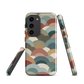 A soft retro-inspired phone case featuring layered arc shapes in warm, earthy tones.