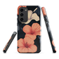 Phone case with coral hibiscus flowers and ivory blooms on dark background
