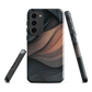 Phone case with flowing abstract design in black, copper and charcoal tones, inspired by dusk shadows