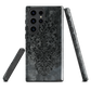 Dark damask patterned phone case with a vintage gothic aesthetic and textured stone background.
