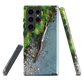 Resting Place phone case with aerial artwork of river rocks, green bush, and driftwood in a New Zealand stream.