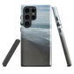 Phone case with a scenic photo of Riversdale Beach and ocean waves.