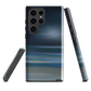 Dark abstract phone case with blue and grey streaks and glossy finish.