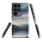 Phone case with moody blue and purple layered mountain and lake landscape artwork