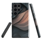Phone case with flowing abstract design in black, copper and charcoal tones, inspired by dusk shadows