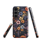 Phone case with colourful wildflowers on dark background, floral art design
