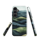 Phone case with layered mountain and forest landscape in blue and green hues