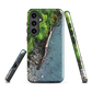 Resting Place phone case with aerial artwork of river rocks, green bush, and driftwood in a New Zealand stream.