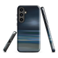 Dark abstract phone case with blue and grey streaks and glossy finish.