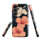 Phone case with coral hibiscus flowers and ivory blooms on dark background