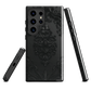 Black embossed obsidian phone case with gothic baroque pattern.
