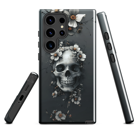 Gothic phone case with a floral skull design in grey tones, featuring white blossoms and dark detailing.