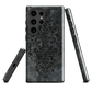 Dark damask patterned phone case with a vintage gothic aesthetic and textured stone background.