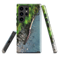 Resting Place phone case with aerial artwork of river rocks, green bush, and driftwood in a New Zealand stream.